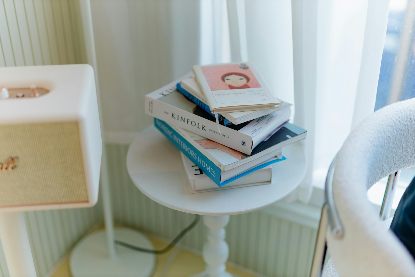 Technical Virtual Assistant Books stacked on a small white table.