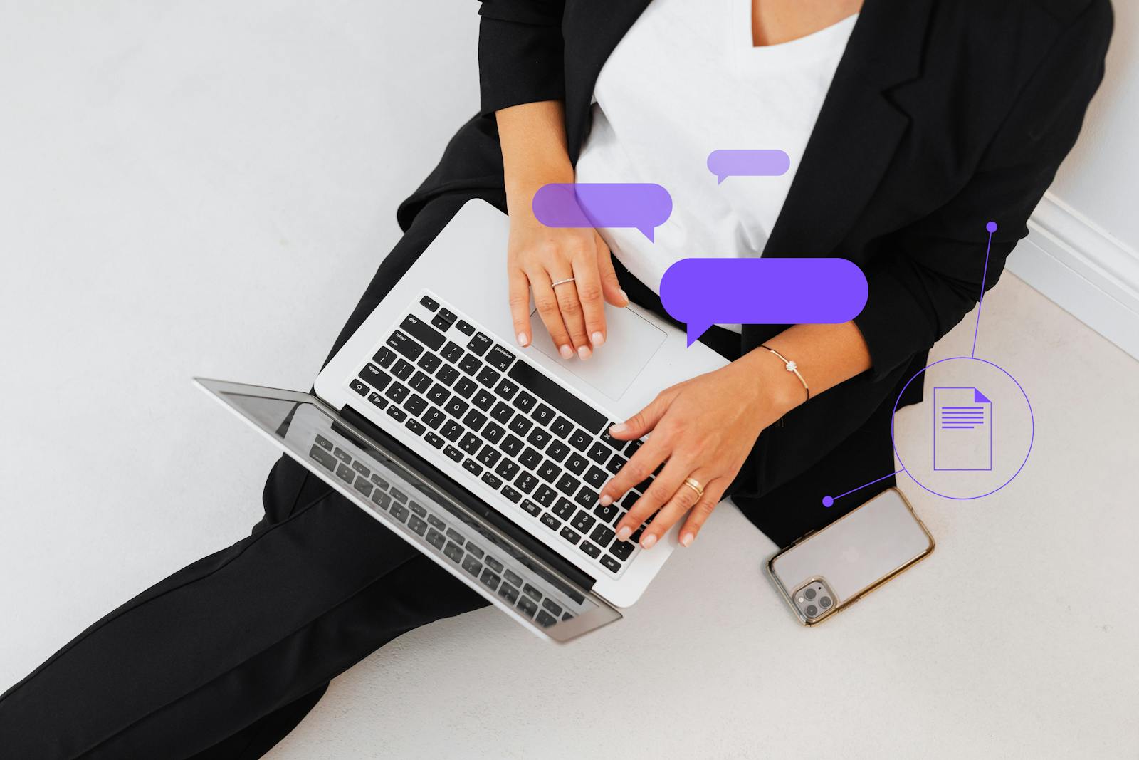FREE AI TOOLS High-angle shot of a woman in black suit using a laptop, symbolizing digital communication.